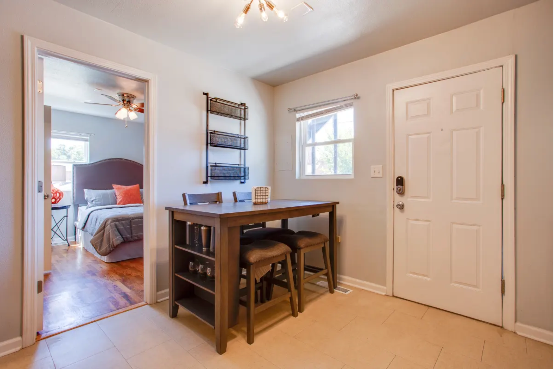There is a dining table and chairs in the middle of the room.