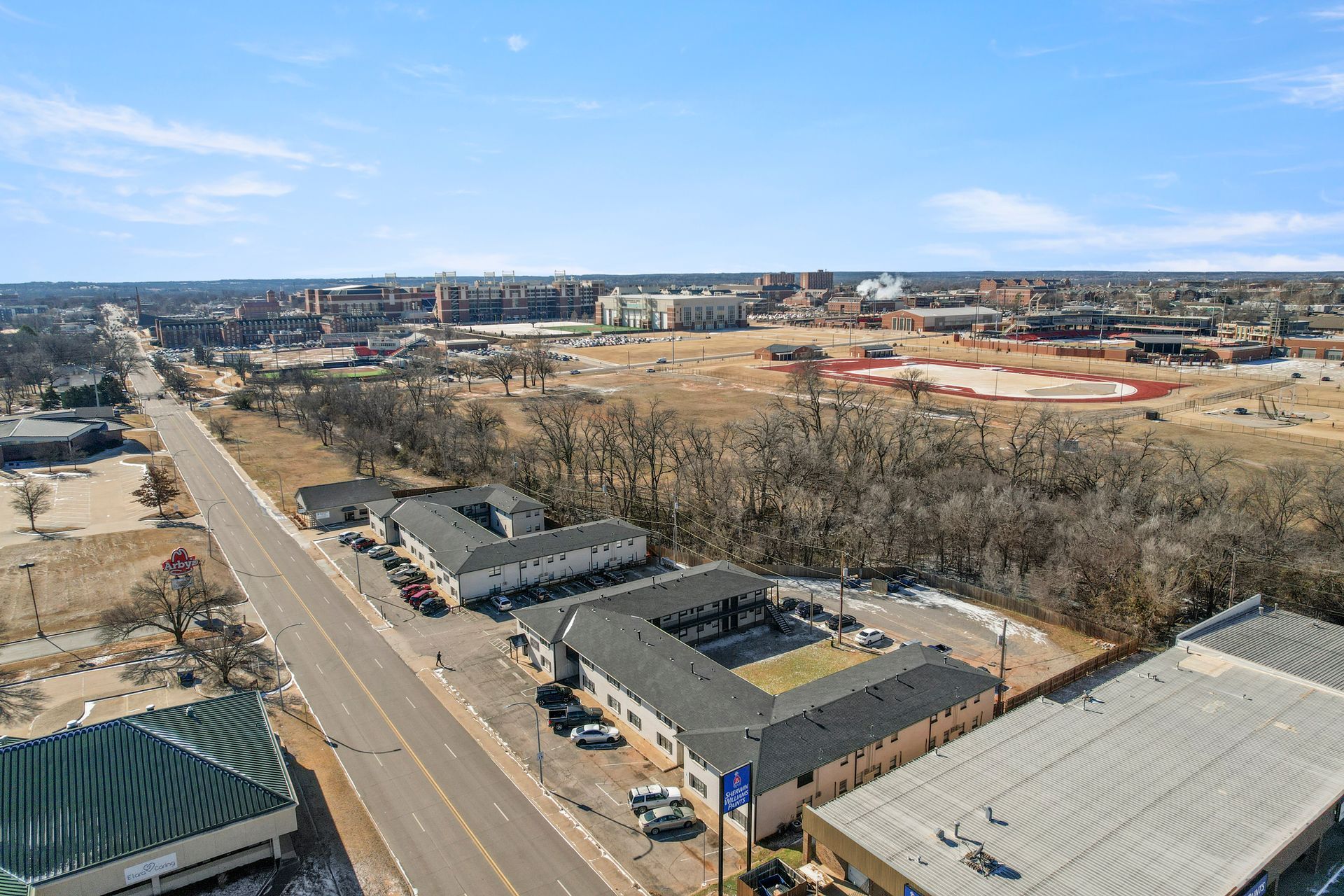 An aerial view of a small town with a lot of buildings and trees.