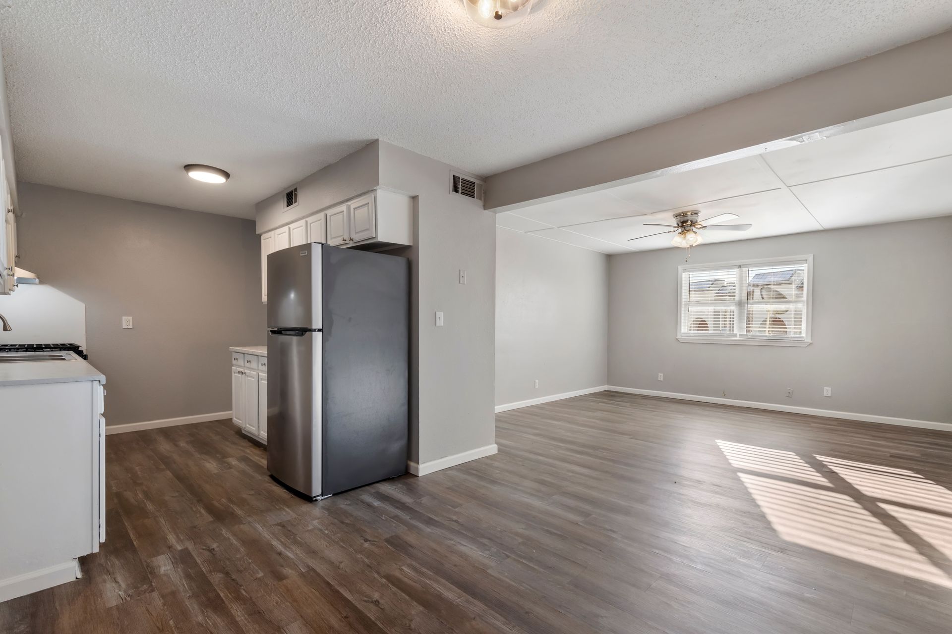 There is a refrigerator in the middle of the room.