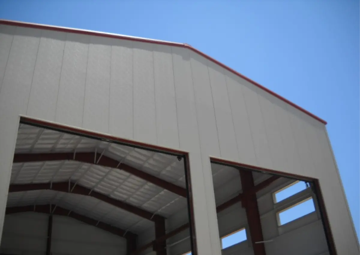 A large building with a blue sky in the background