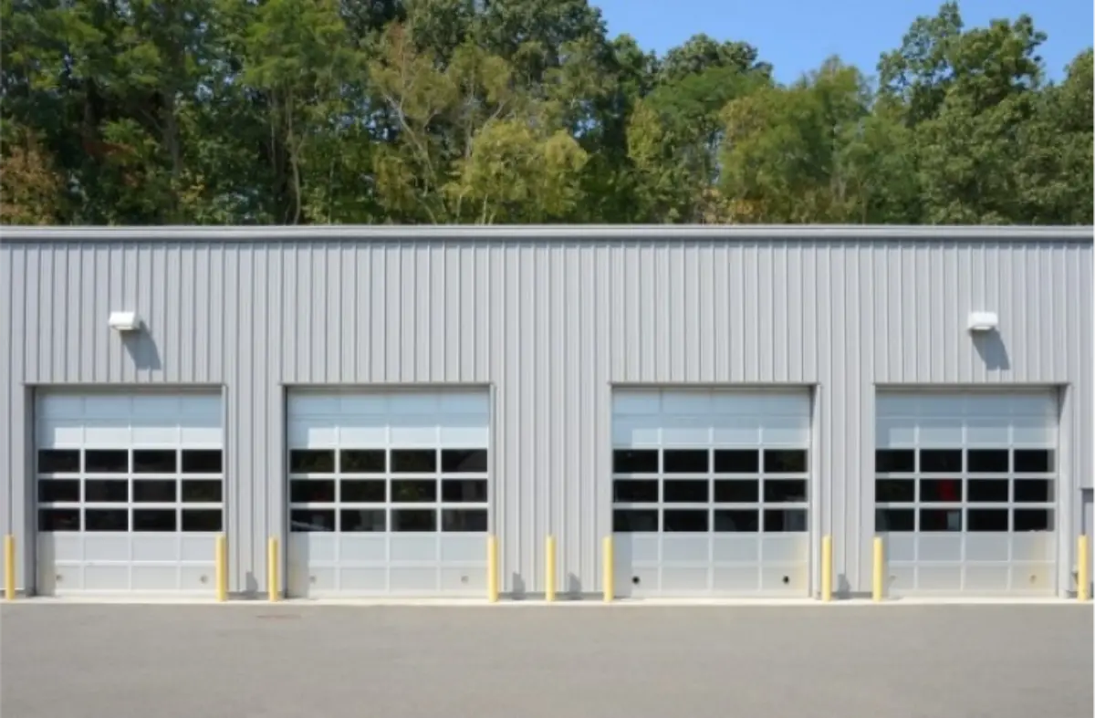 A row of garage doors on the side of a building.