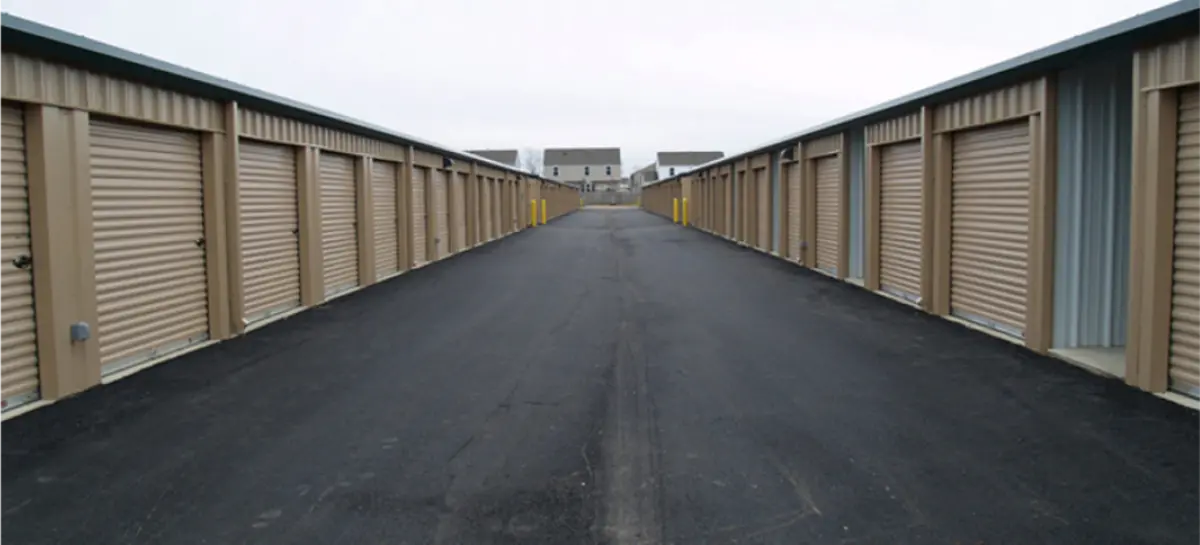 A row of storage units on the side of a road.
