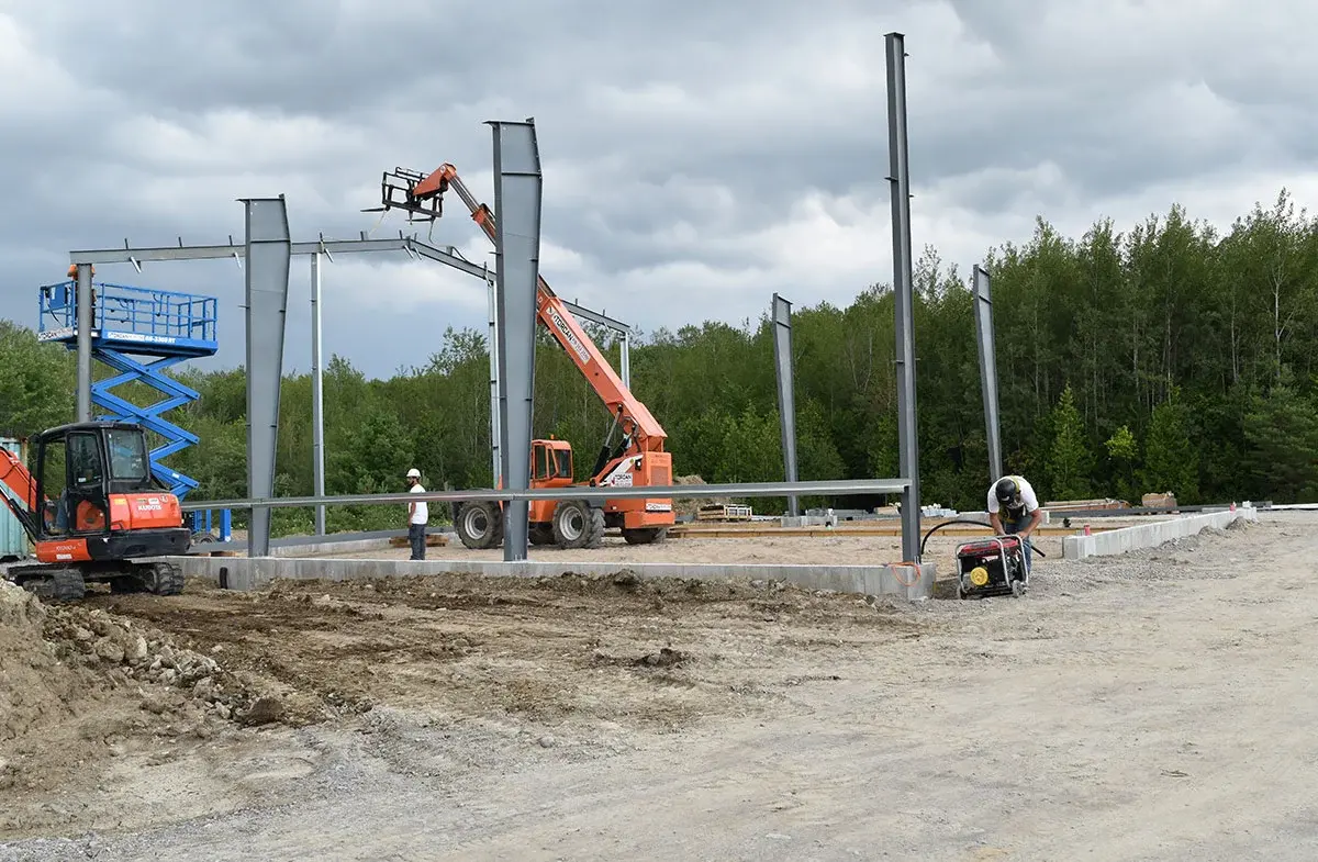 A construction site with a tractor and a crane.