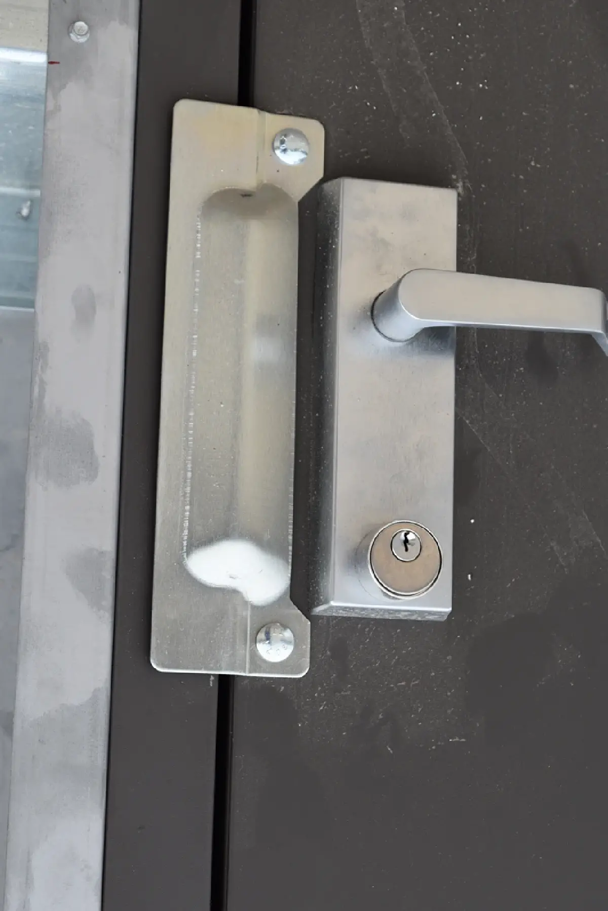 A close up of a door handle with a key on it