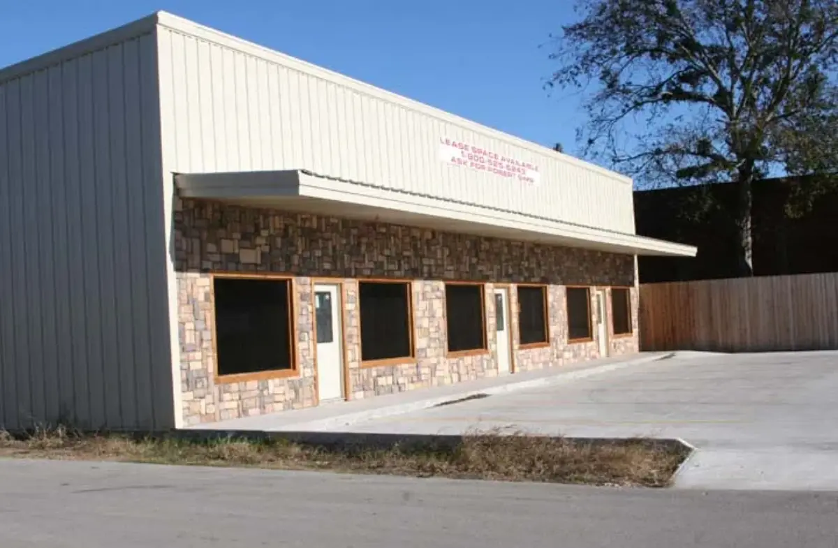 A building with a sign that says ' jc ' on it