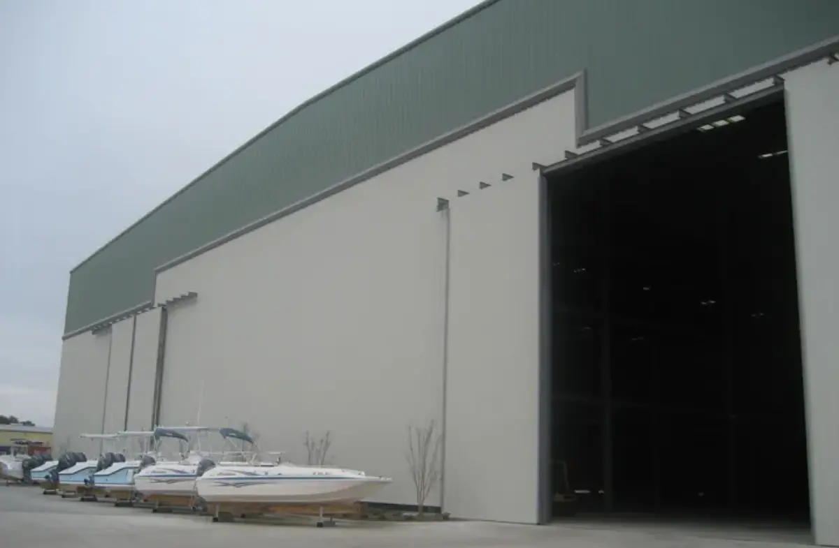 A row of boats are parked in front of a building