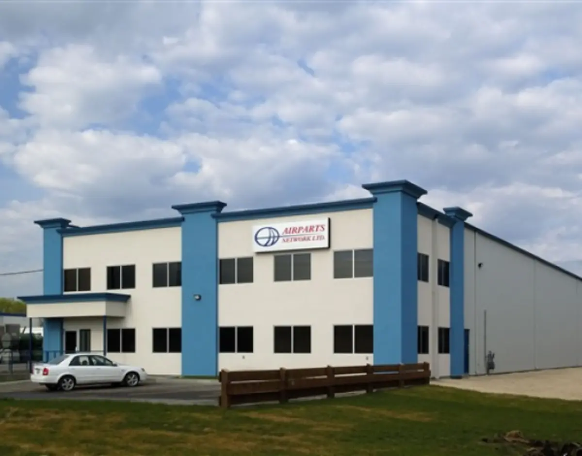 A large white building with blue trim and a sign that says ' chambers ' on it