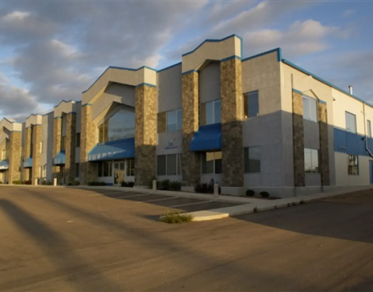 A building with a blue awning on the side of it