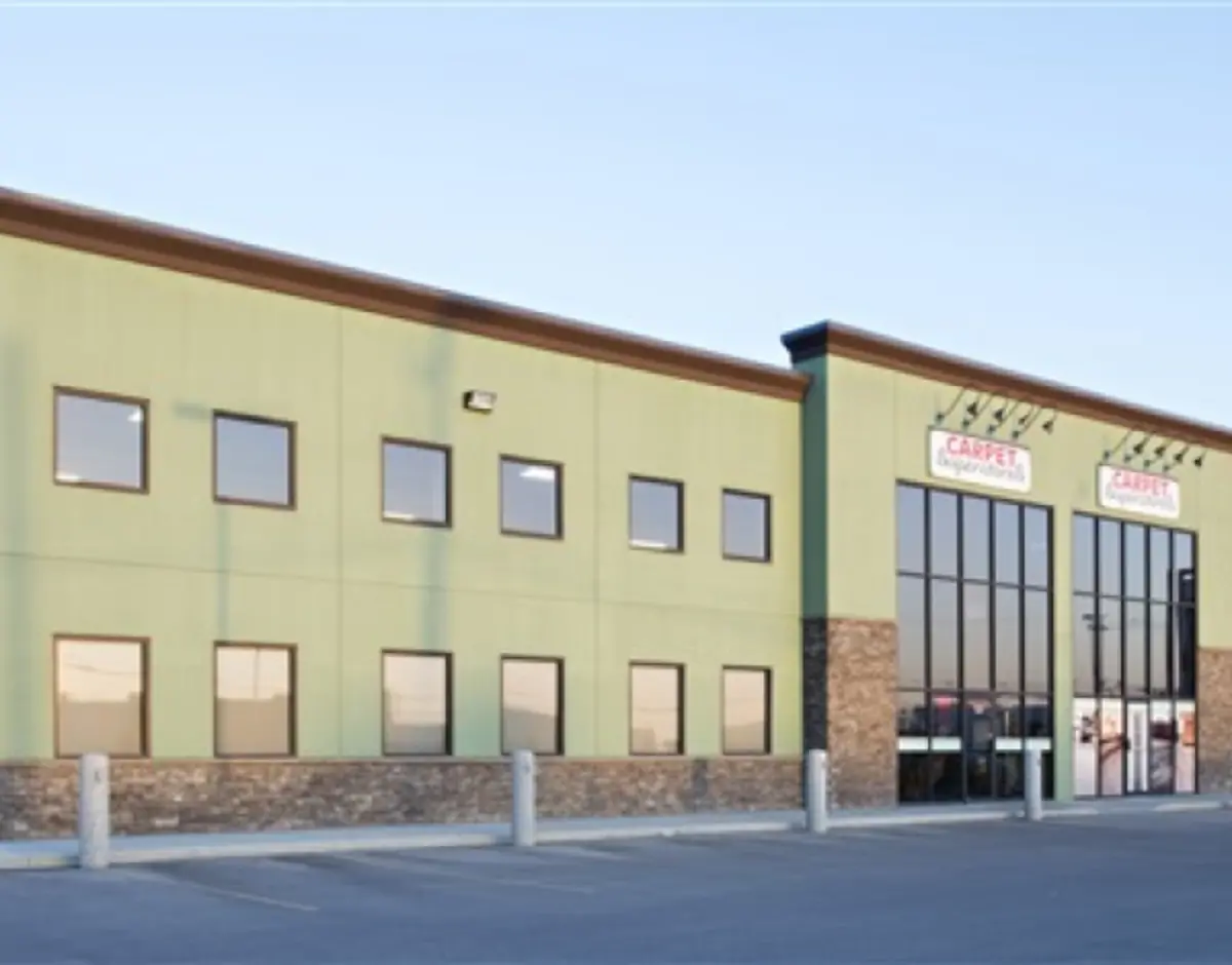 A green building with a sign that says ' crafts ' on it