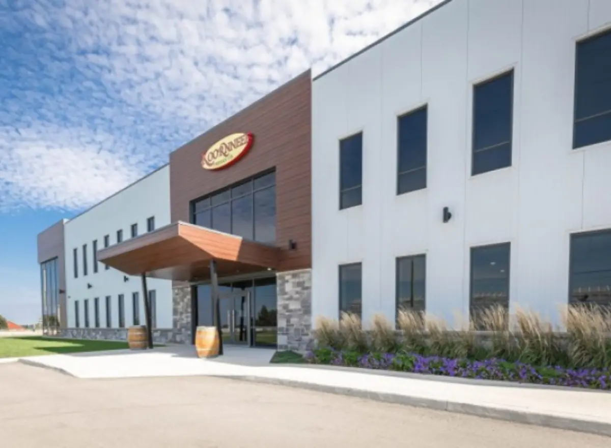 A large building with a sign that says ' coca cola ' on it