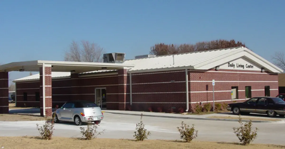 A building with a car parked in front of it