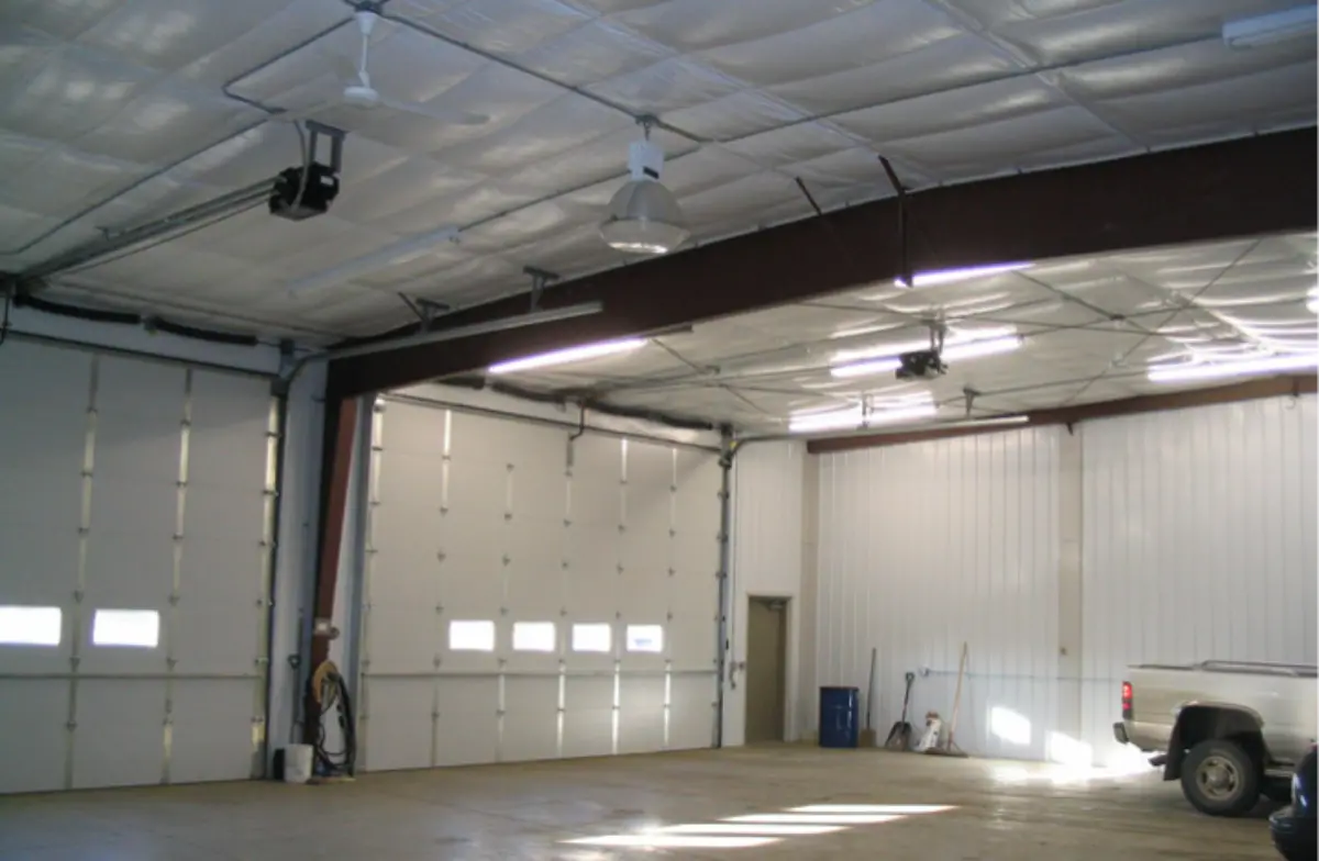 An empty garage with a truck parked in it