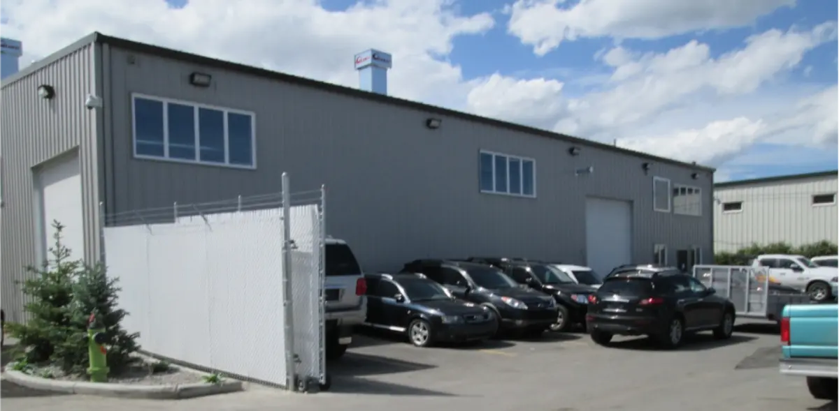 A building with a lot of cars parked in front of it