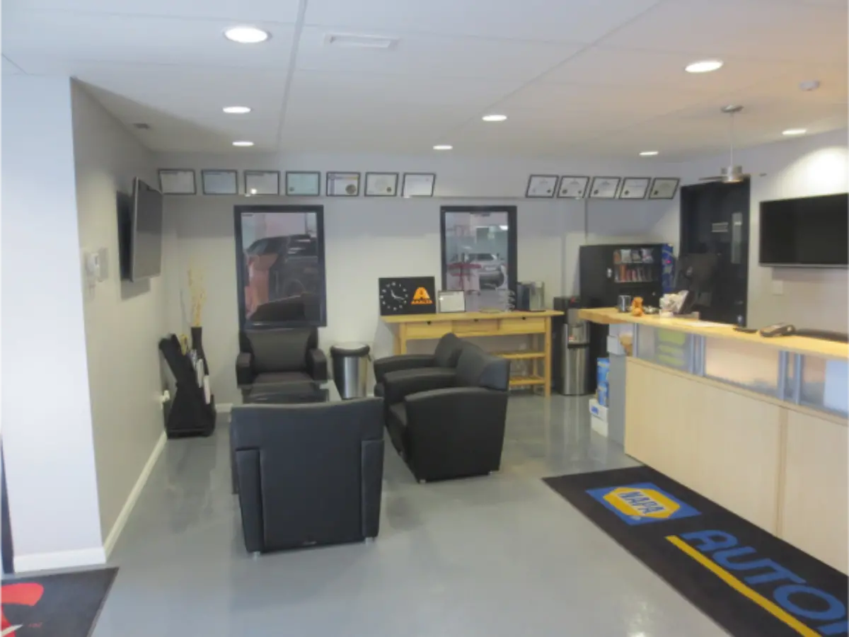 A waiting room with a rug that says auto on it