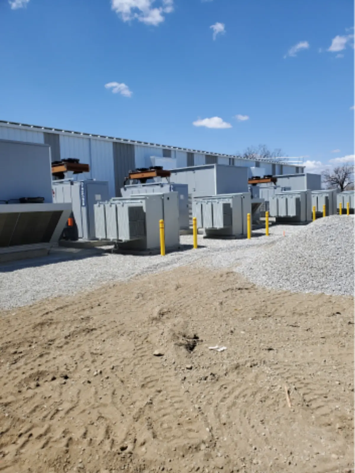 A row of buildings with a blue sky in the background
