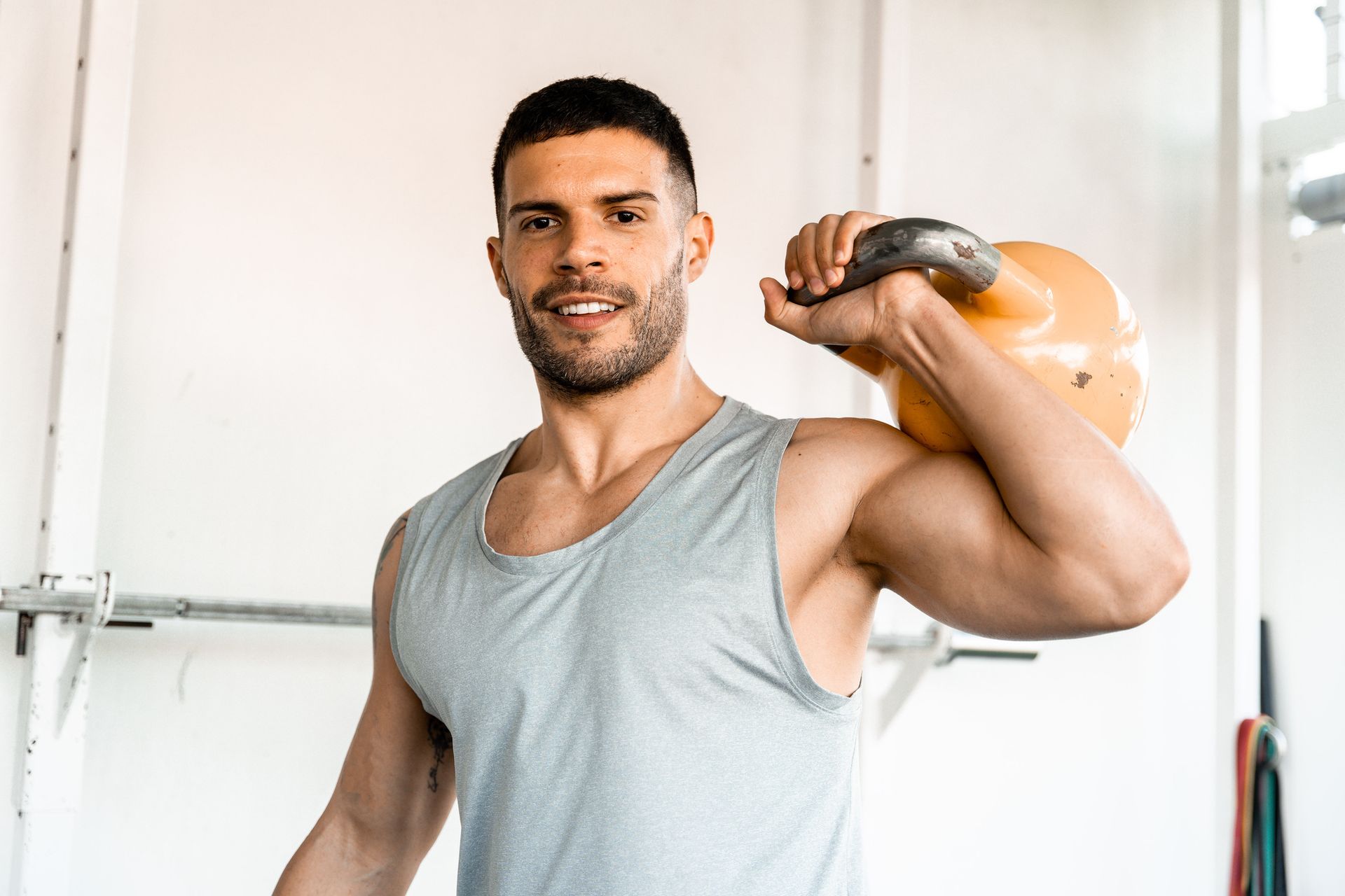 A man lifting kettlebell promoting bioidentical hormone replacement therapy. A man lifting kettlebell promoting bioidentical hormone replacement therapy.