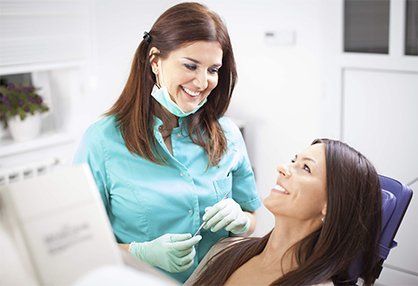 Young woman patient and dentist—Established Dentistry Center in Fountain Valley, California