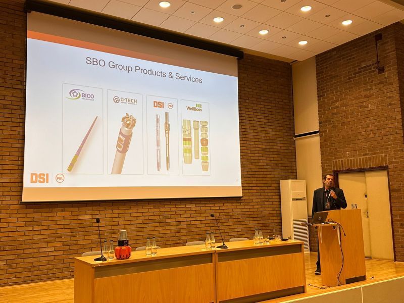 Palm trees against a blue and gold sky.