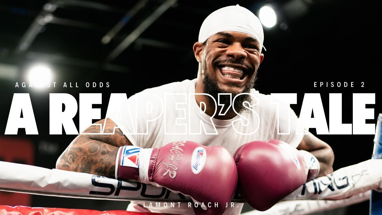 Boxer smiling, leaning on ropes with gloves, titled 