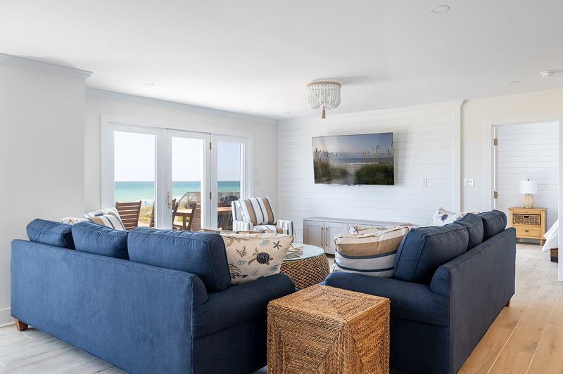A living room filled with furniture and a flat screen tv.