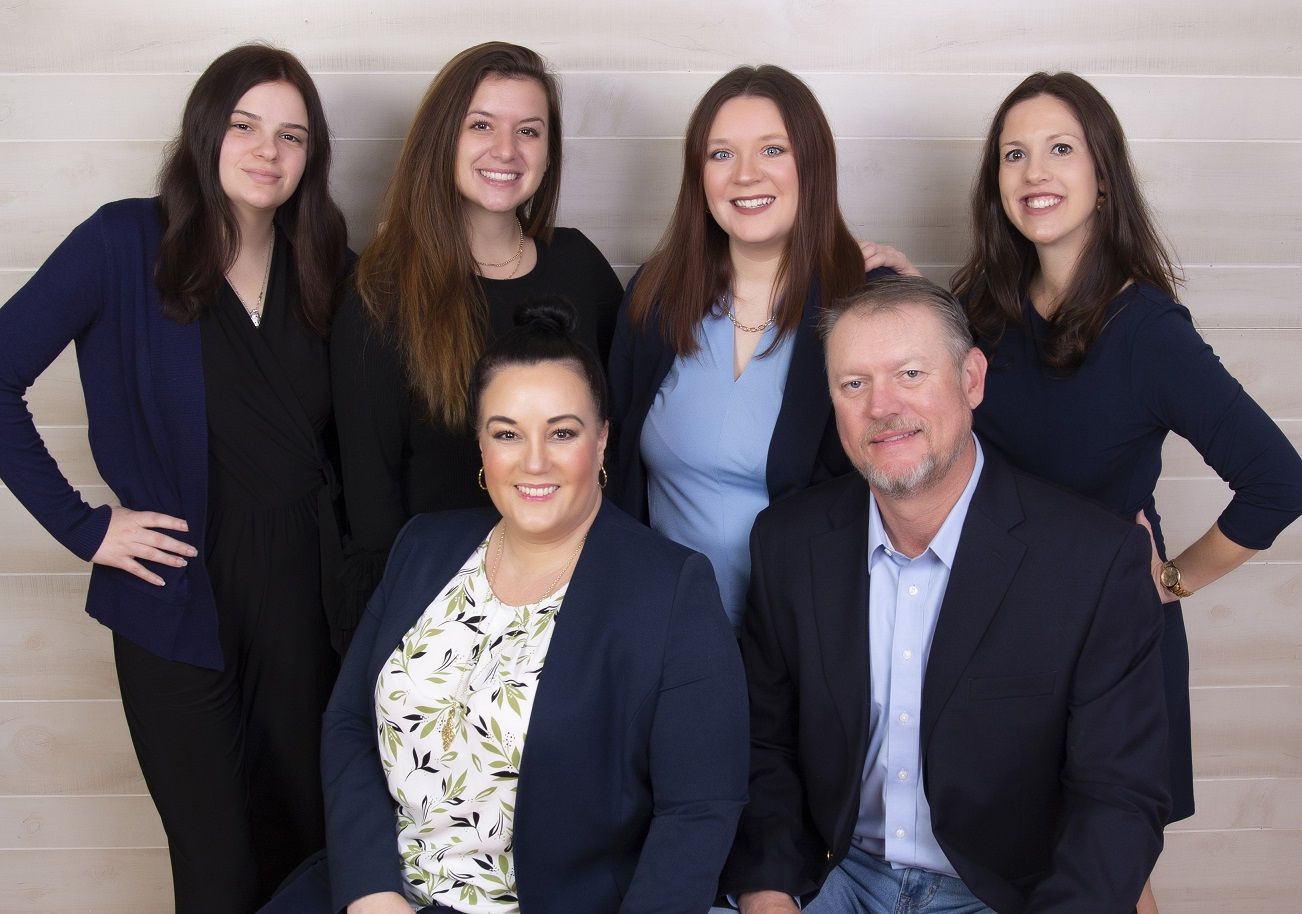 A group of people are posing for a picture together.