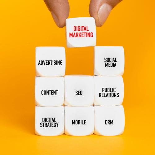 Hand holding a cube labeled