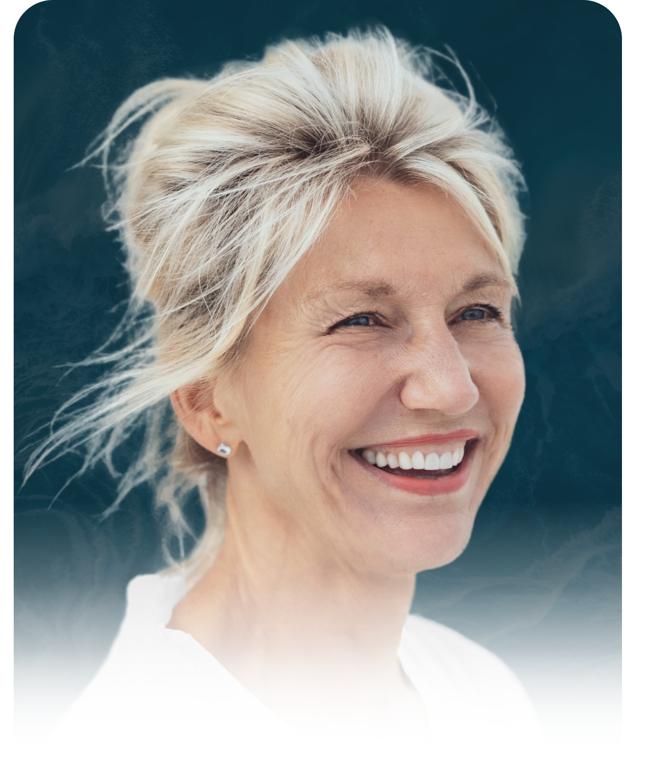 A woman with blonde hair is smiling for the camera.