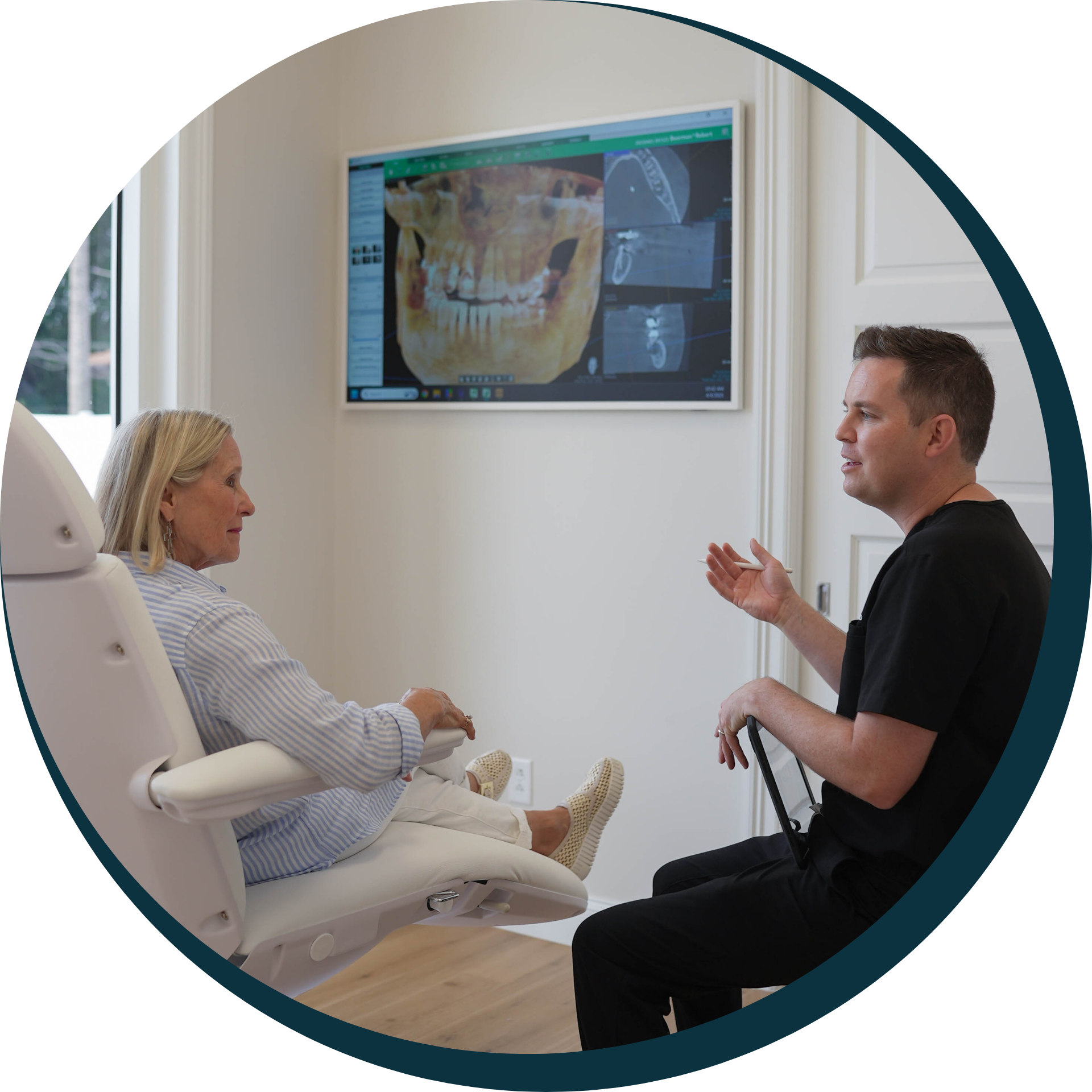 A man is getting his teeth examined by a female dentist.