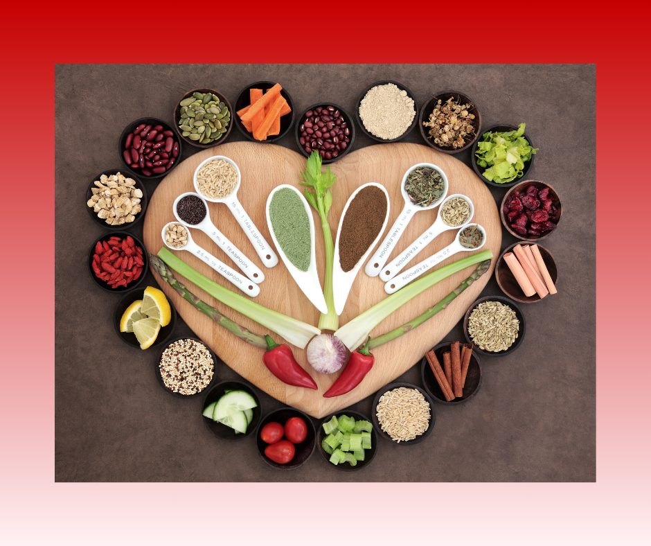 Heart-shaped wooden board displaying measuring spoons of various spices and herbs anti-inflammatory