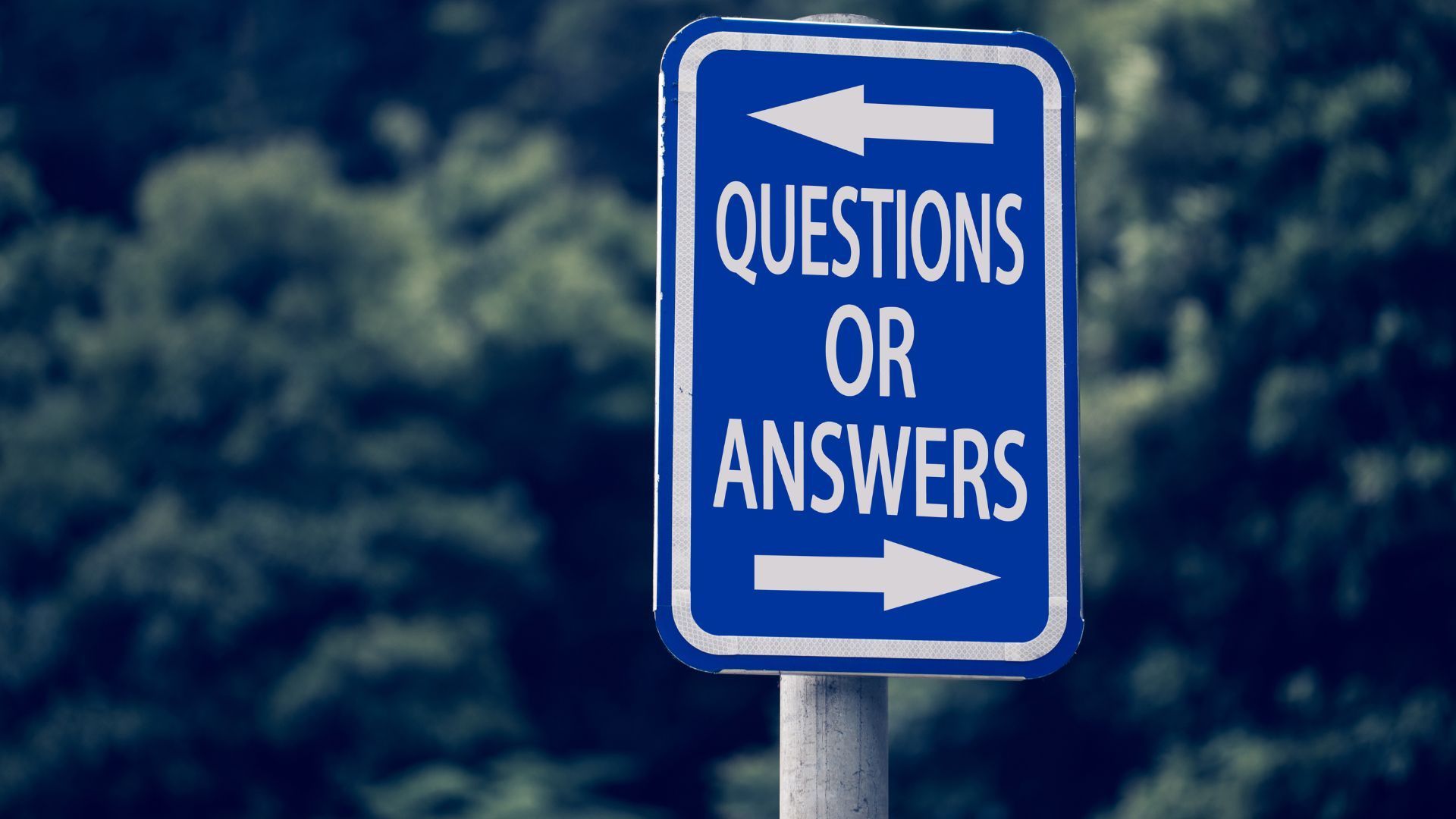 Blue sign on a pole with