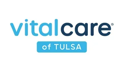 VitalCare of Tulsa logo with blue text on a white background.