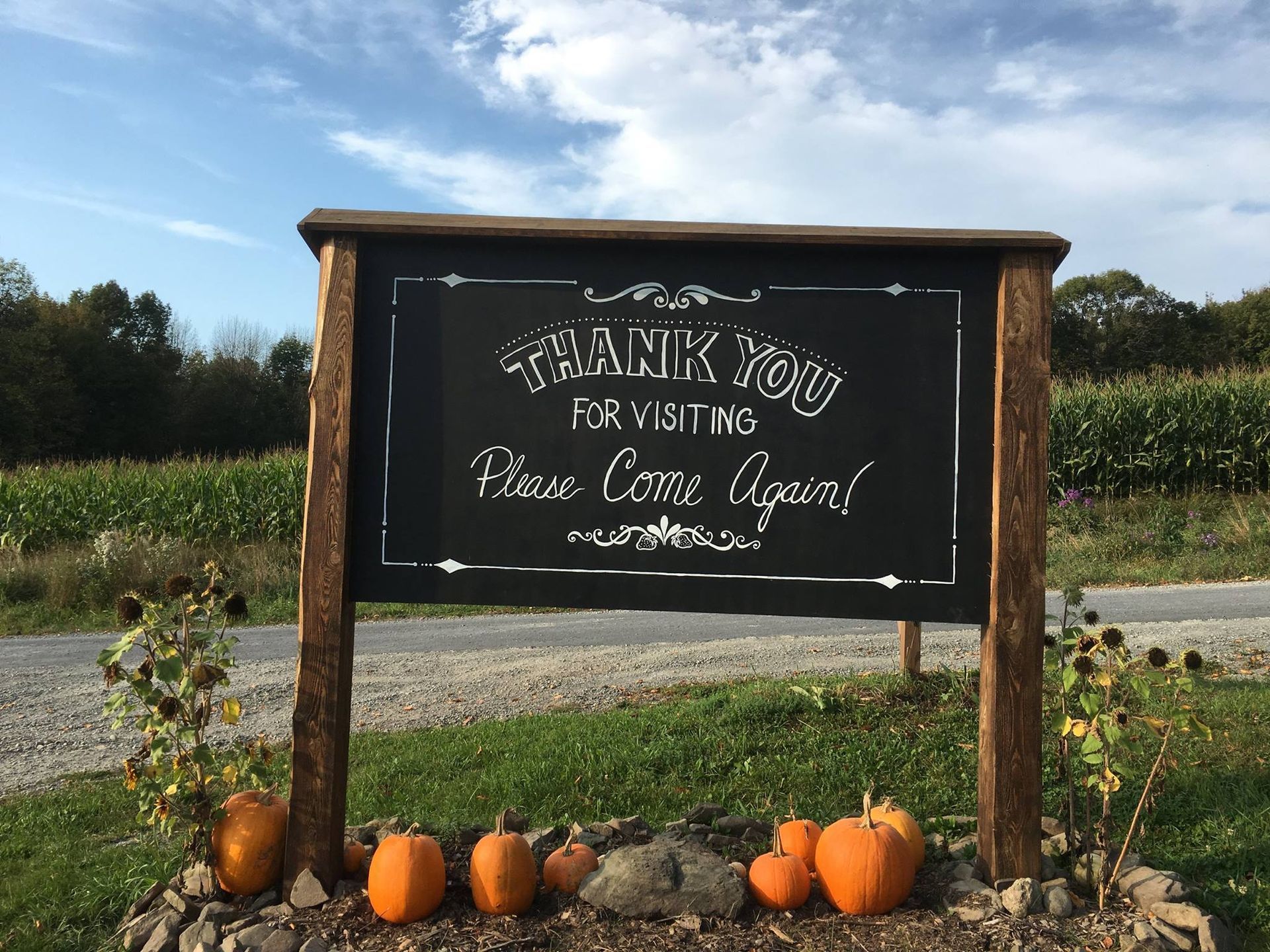 A chalkboard sign that says thank you for visiting