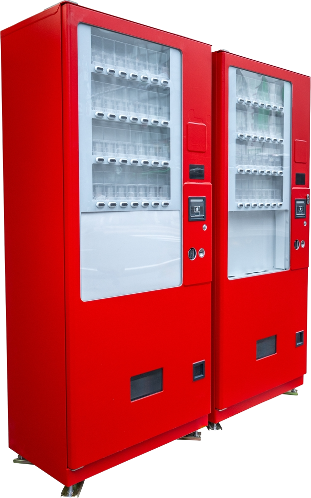 Two red vending machines side by side, with clear windows displaying empty shelves.