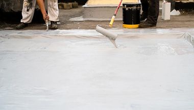 Applying Seal Coating on Flat Roof — Springfield, MA — D.P. Carney Construction, Inc.