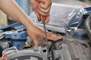 Car Mechanic working—auto repair services in Oldsmar, FL