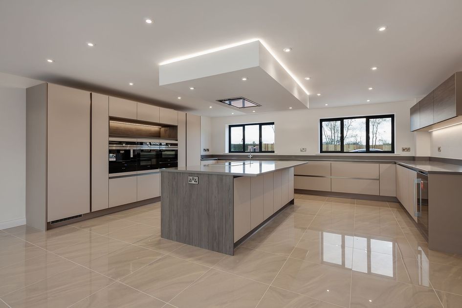 There is a large island in the middle of the kitchen.