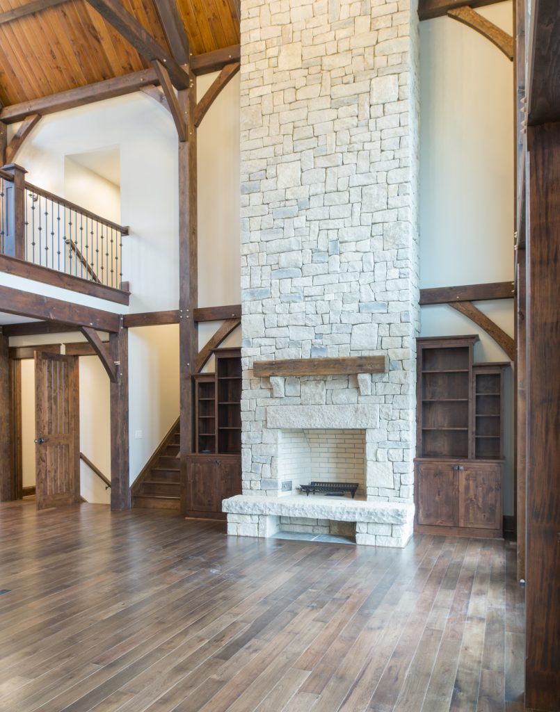 There is a large fireplace in the middle of the room.