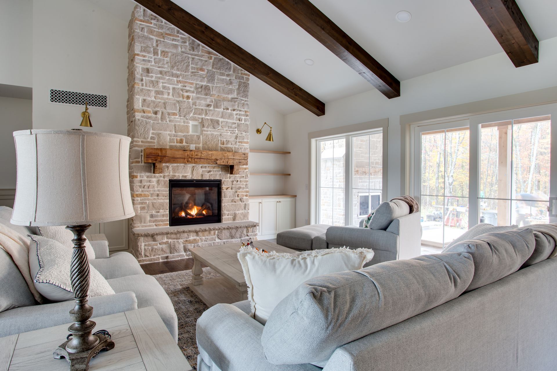 There is a fireplace in the middle of the living room.
