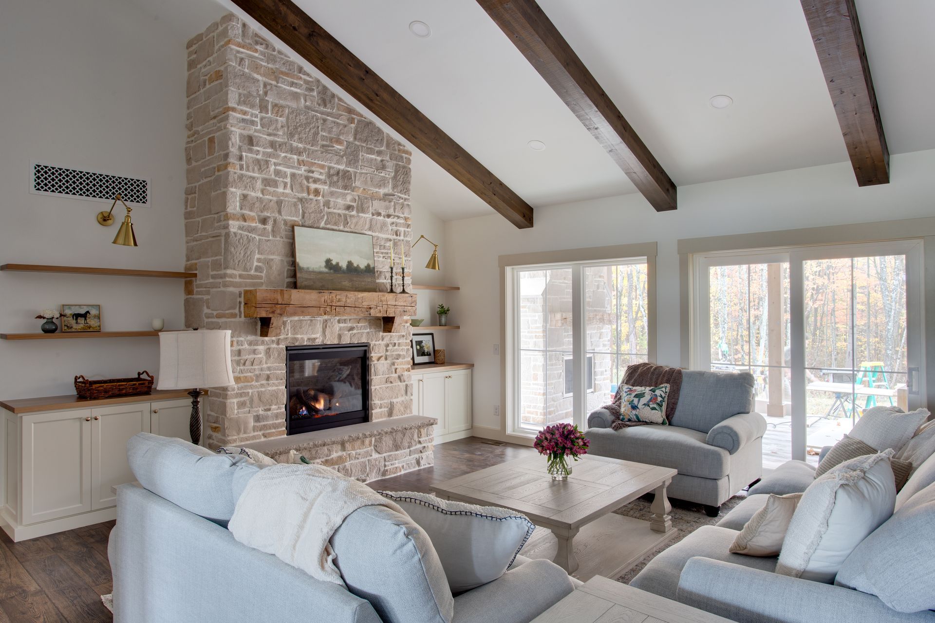 There is a fireplace in the middle of the living room.