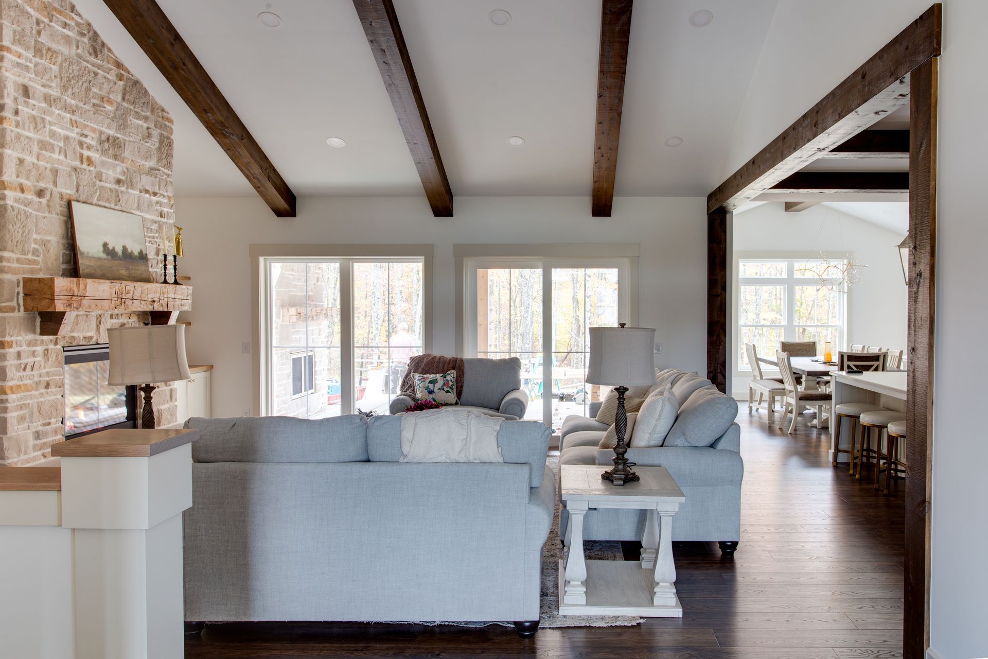 A living room filled with furniture and a fireplace.