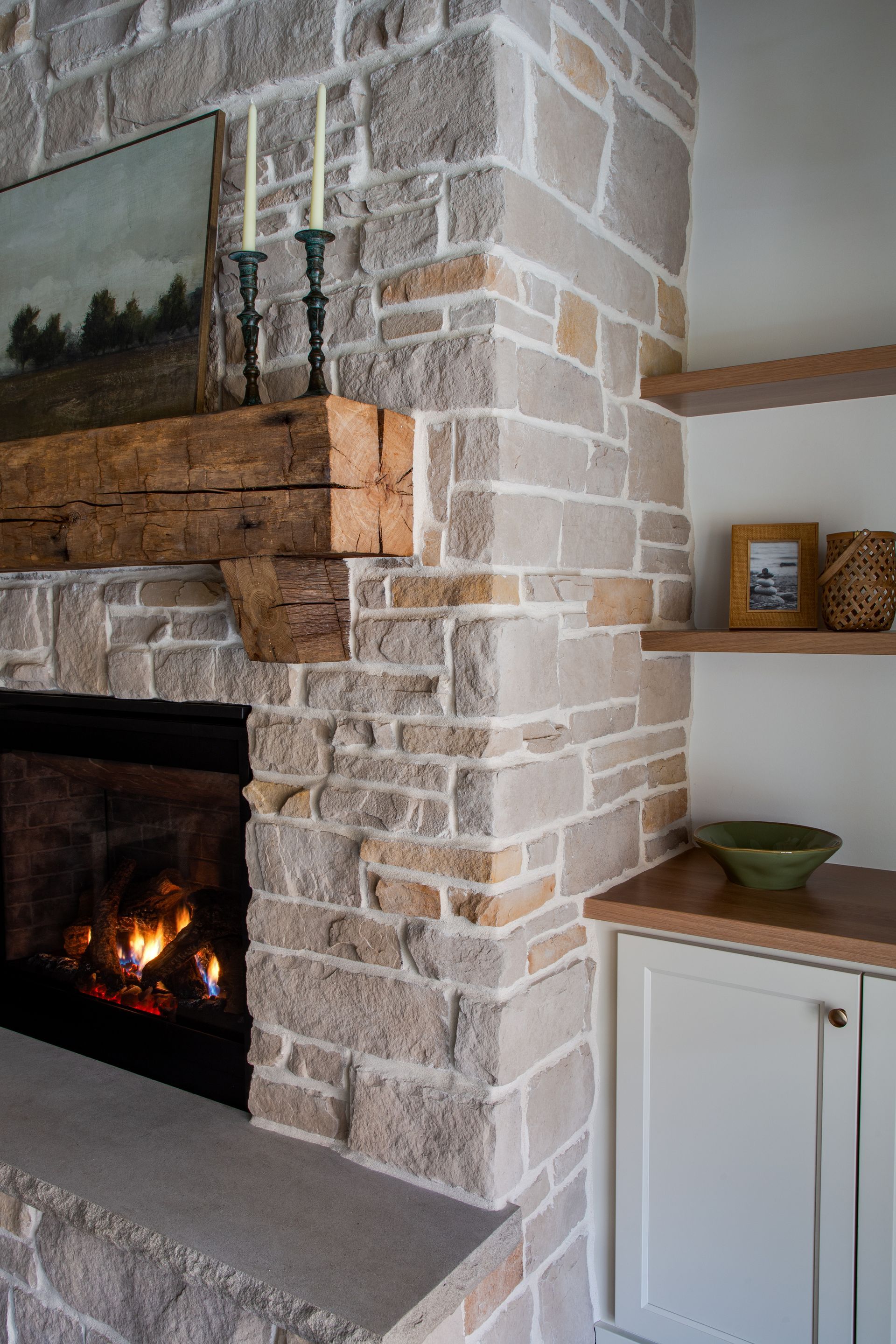 There is a fireplace in the corner of the room.