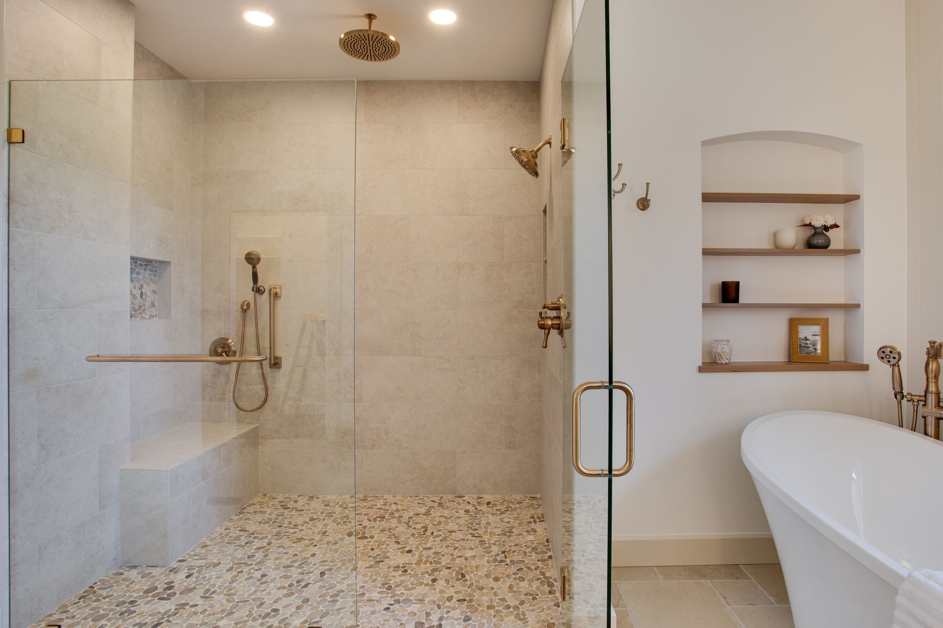 A bathroom with a walk in shower and a bathtub.
