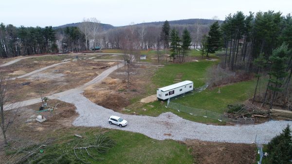 An aerial view of a rv parked on the side of a road.
