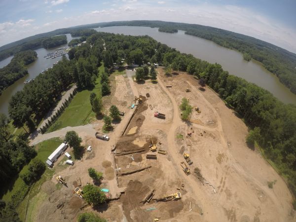 An aerial view of a construction site next to a river.
