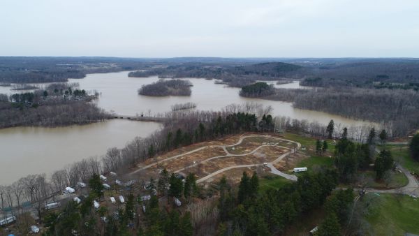 An aerial view of a large body of water surrounded by trees.