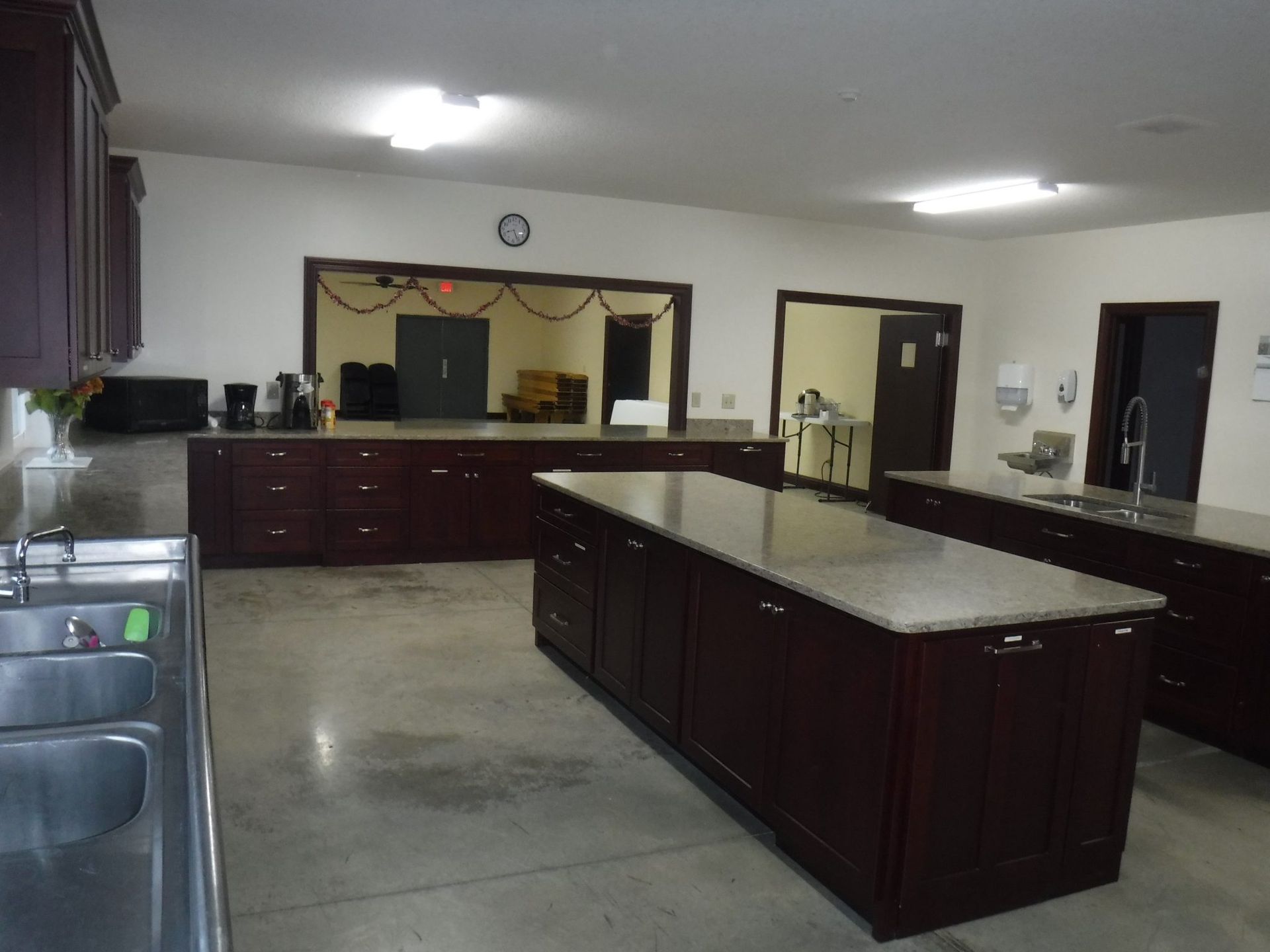 A kitchen with a large island and a sink.