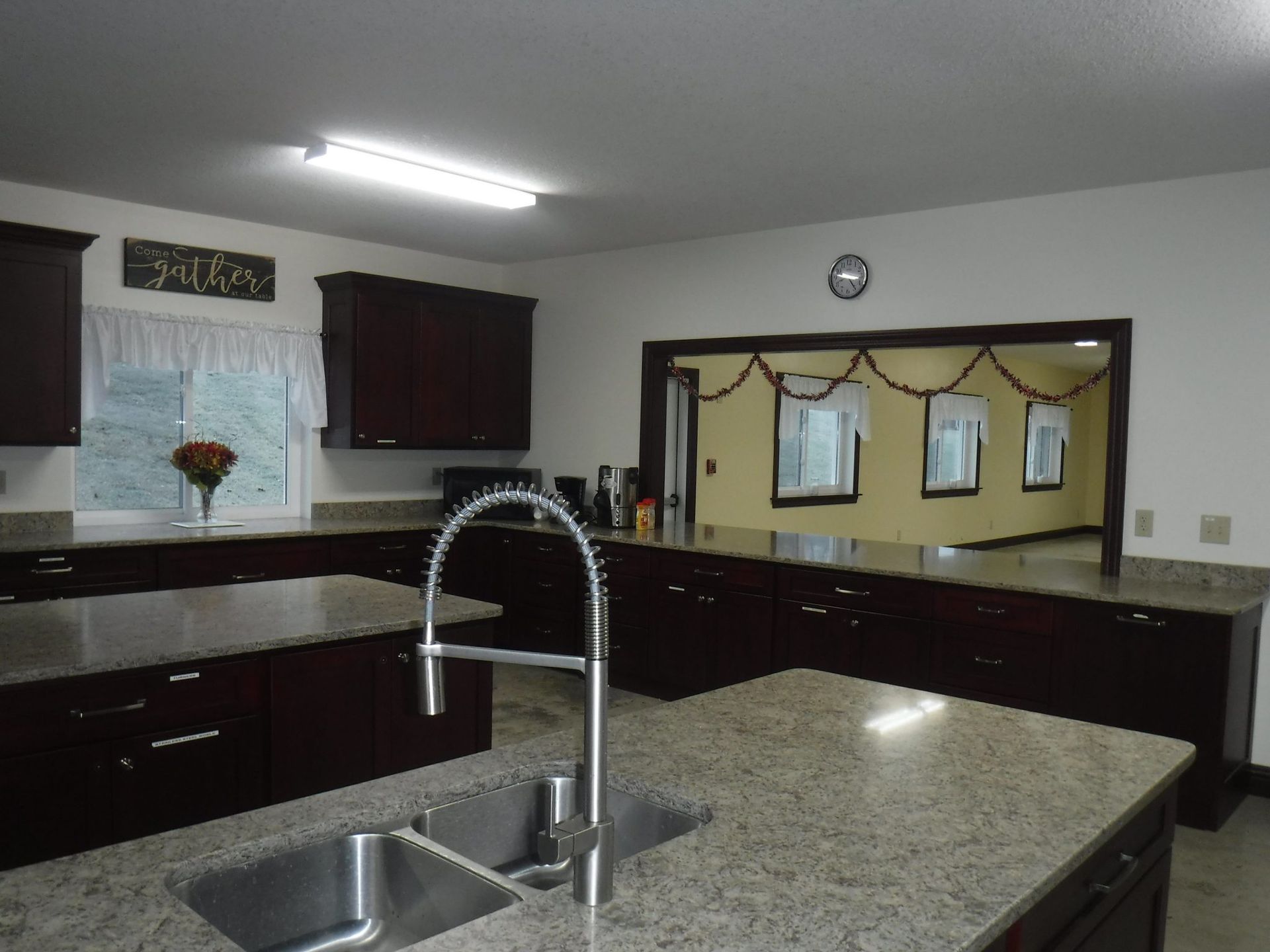 A kitchen with granite counter tops and a sink.