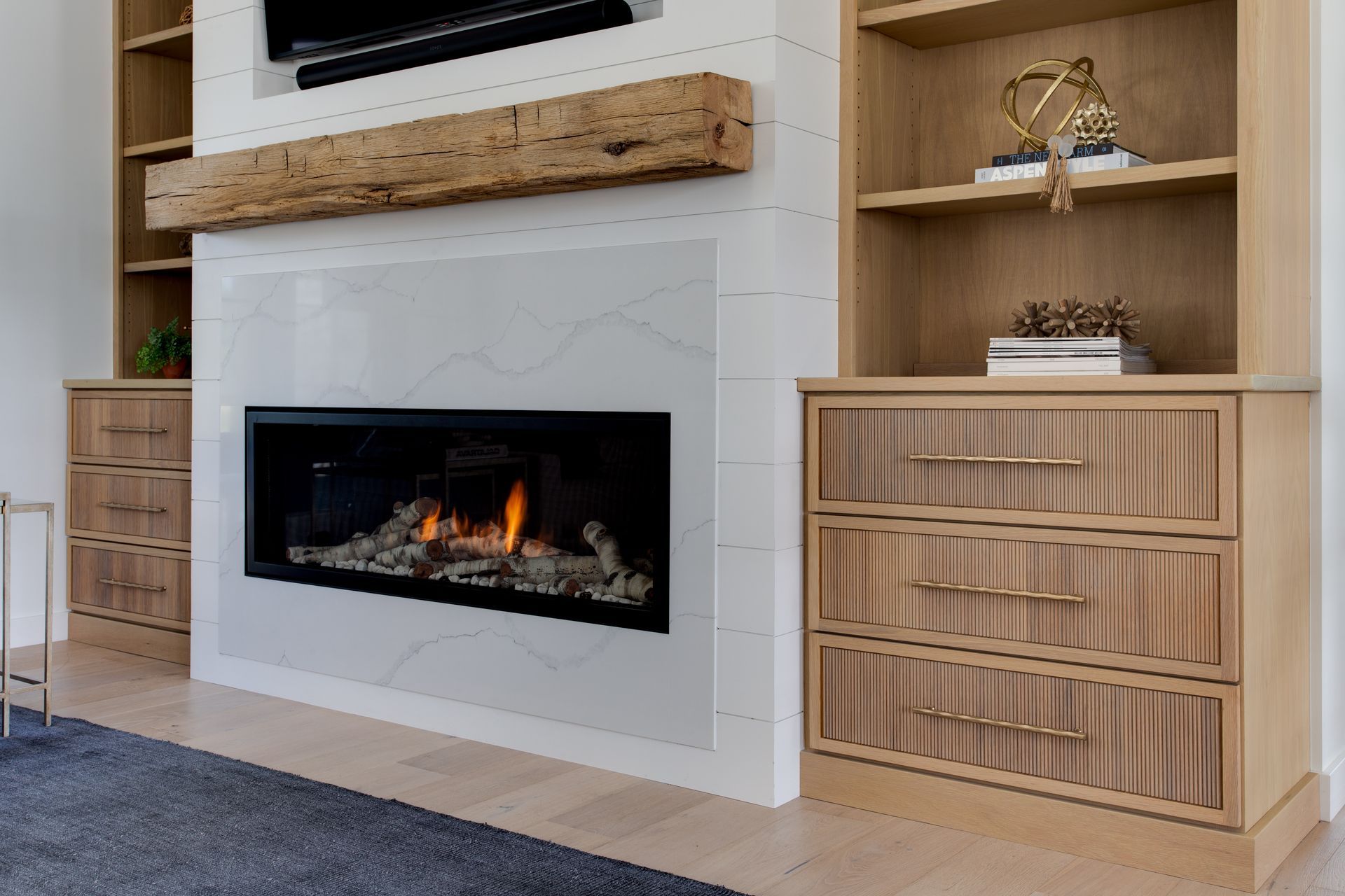 There is a fireplace in the middle of the room.