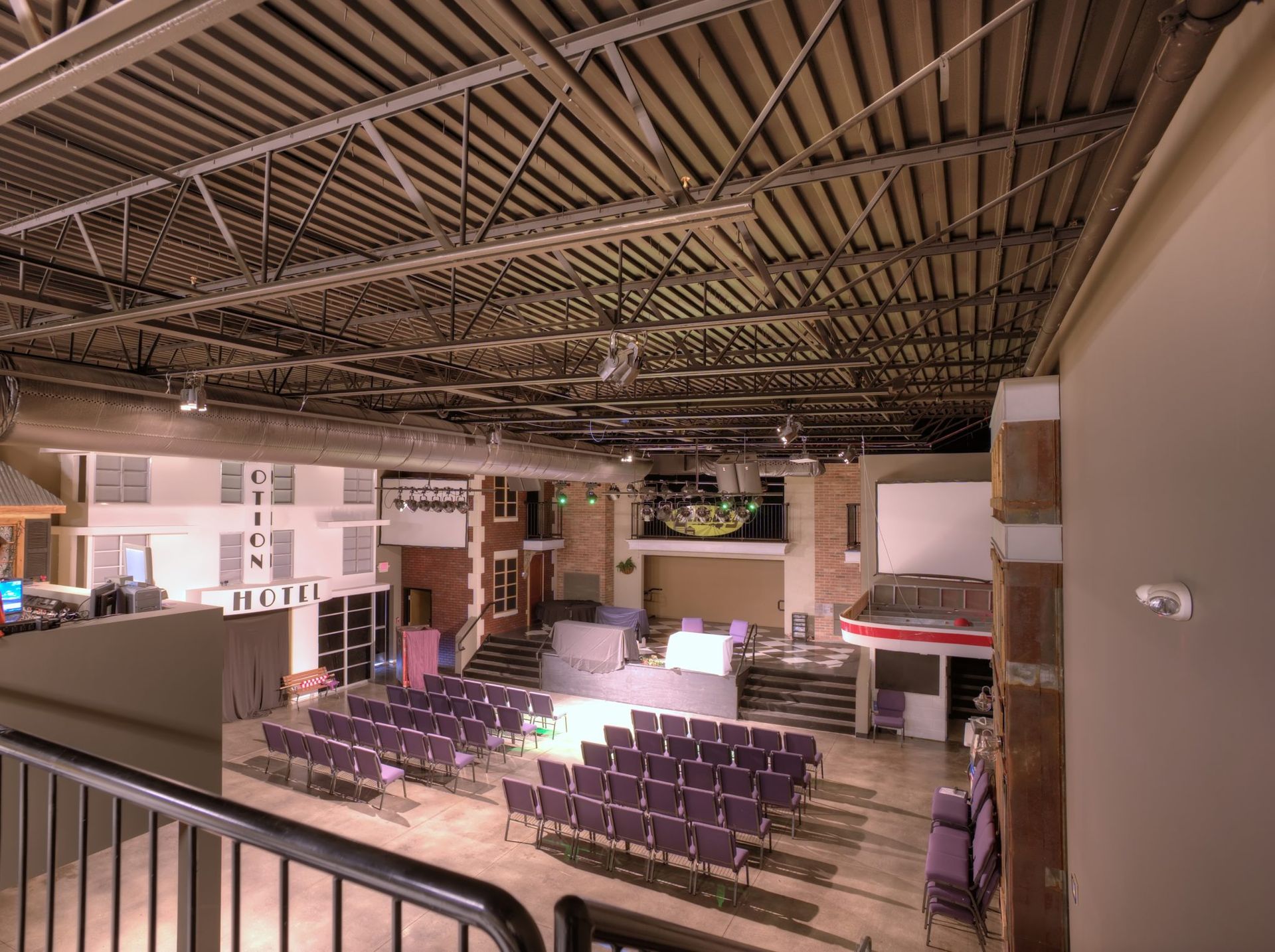 An aerial view of a large auditorium with rows of chairs