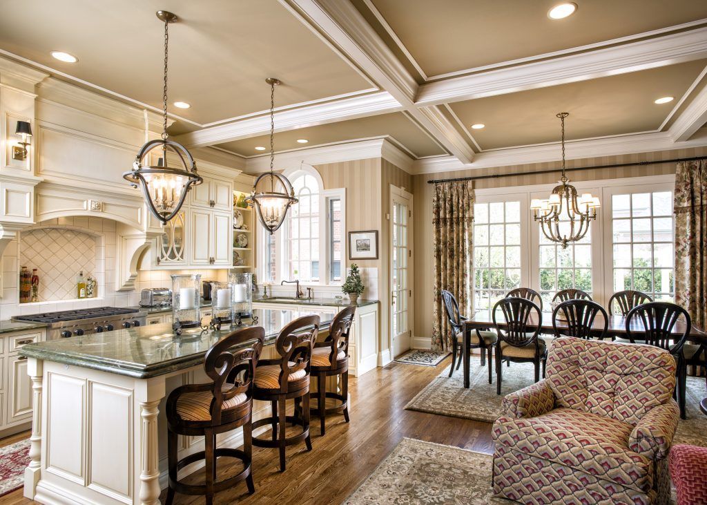 A kitchen with a large island in the middle of it.